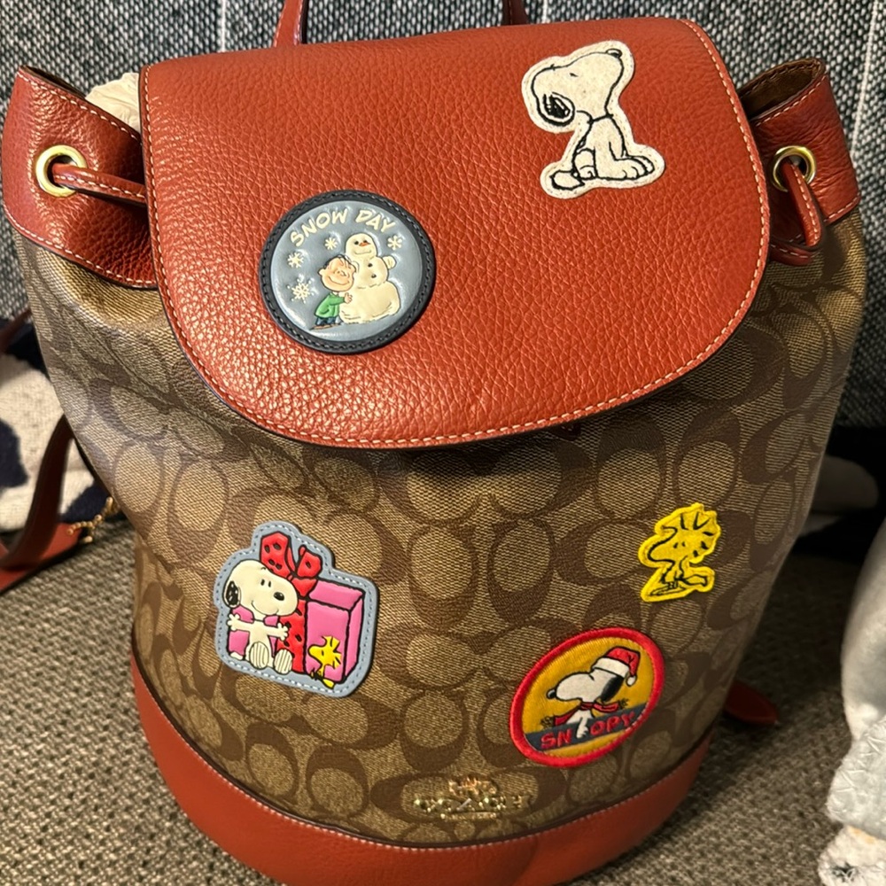 Signature coated canvas and refined calf leather